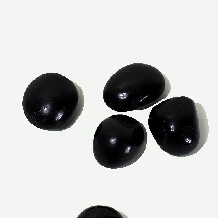 BlackTourmalinePalmStonesbyModernWomen_SarahFaithGottesdienerTarot_TheMoonBookManyMoons_BlackTourmalineCrystalMeaning.png